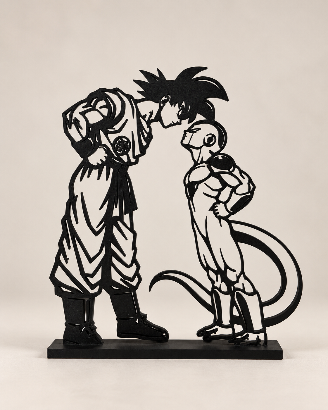 Saiyan vs Alien – black line-art display on light studio background