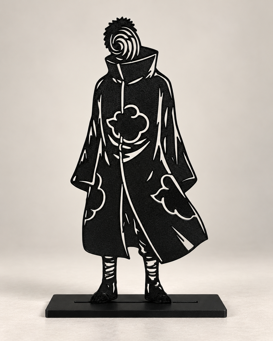 Masked Ninja – black line-art display on light studio background